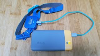 Review photo of the BioLite charge 40 PD power bank plugged into the BioLite 425 Head Lamp