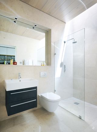 bathroom in a mobile home in the New forest with black modern vanity and walk-in shower