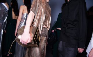 lady wearing a metallic golden fabric dress