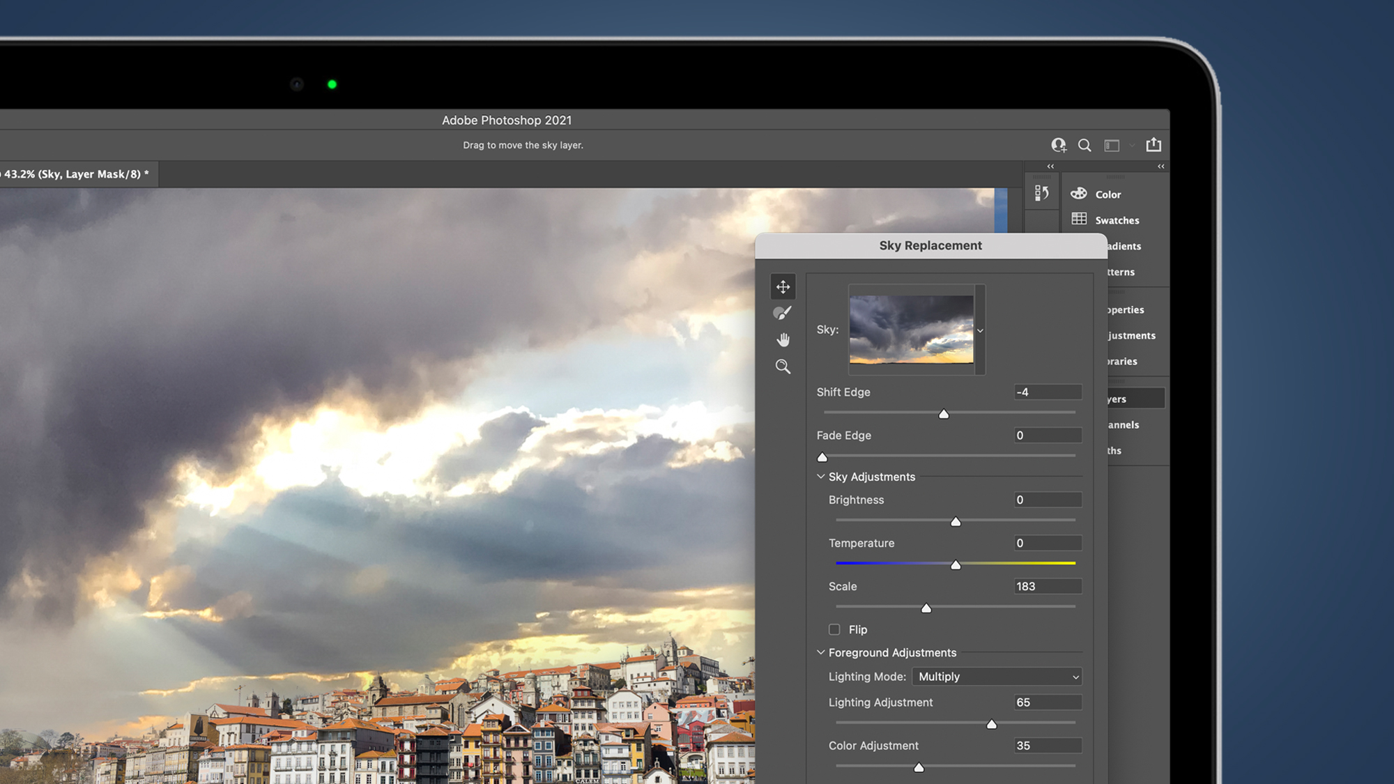 The Photoshop Sky Replacement tool's dialogue box on a laptop screen