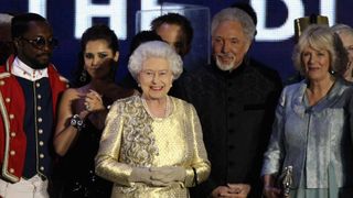 Queen Elizabeth II (C) with (L-R) Will.i.am, Cheryl Cole, Sir Tom Jones and The Duchess of Cornwall on stage during the Diamond Jubilee concert