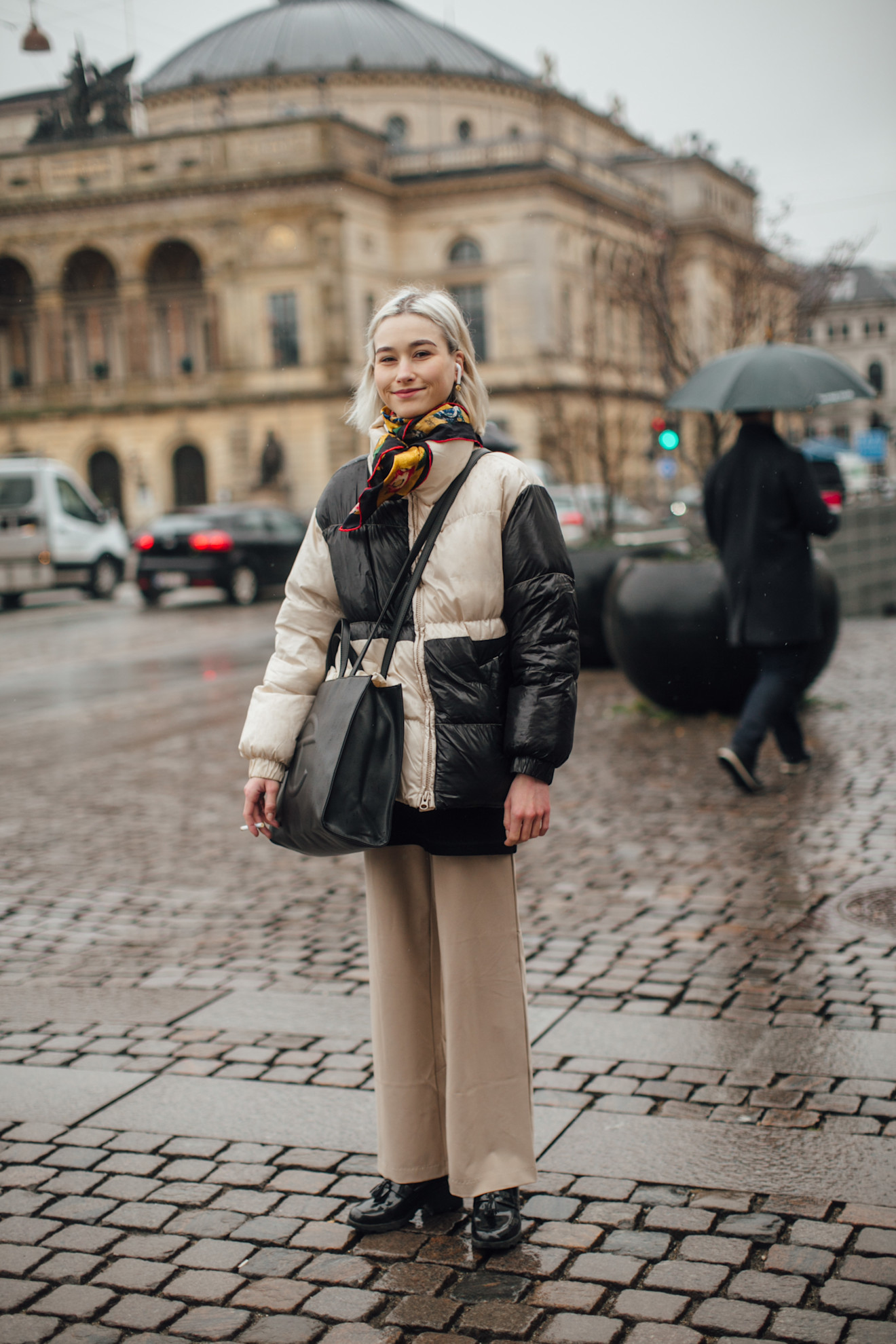 A woman at fashion wearing a puffer jacket outfit