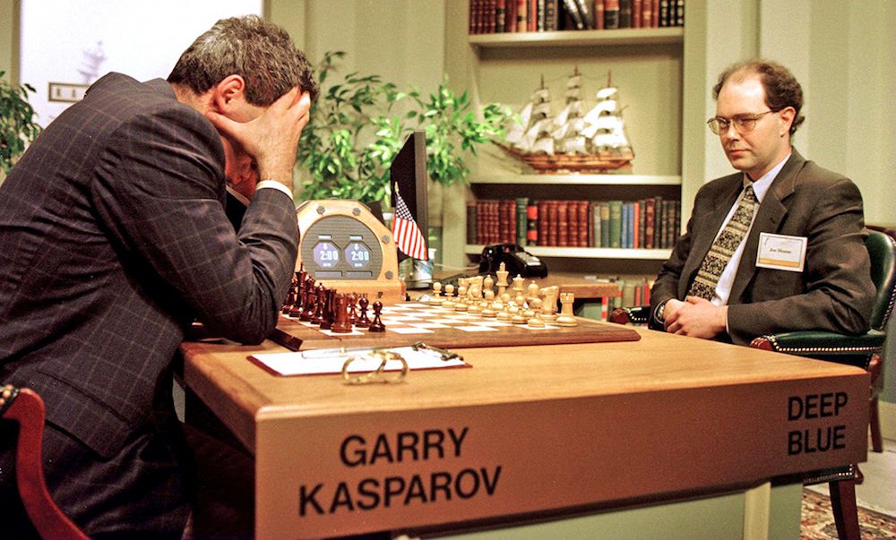 World Chess champion Garry Kasparov (left) ponders a chess move during the sixth and final game of his match with IBM&#039;s Deep Blue computer on May 11, 1997.