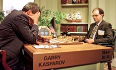World Chess champion Garry Kasparov (left) ponders a chess move during the sixth and final game of his match with IBM's Deep Blue computer on May 11, 1997.