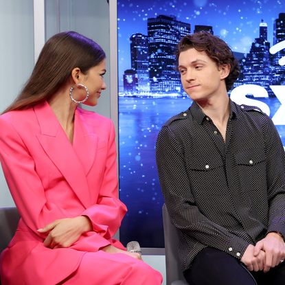 Tom Holland and Zendaya gaze at one another during a press call