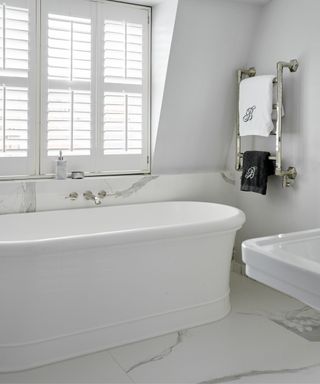Bathroom with large white bath