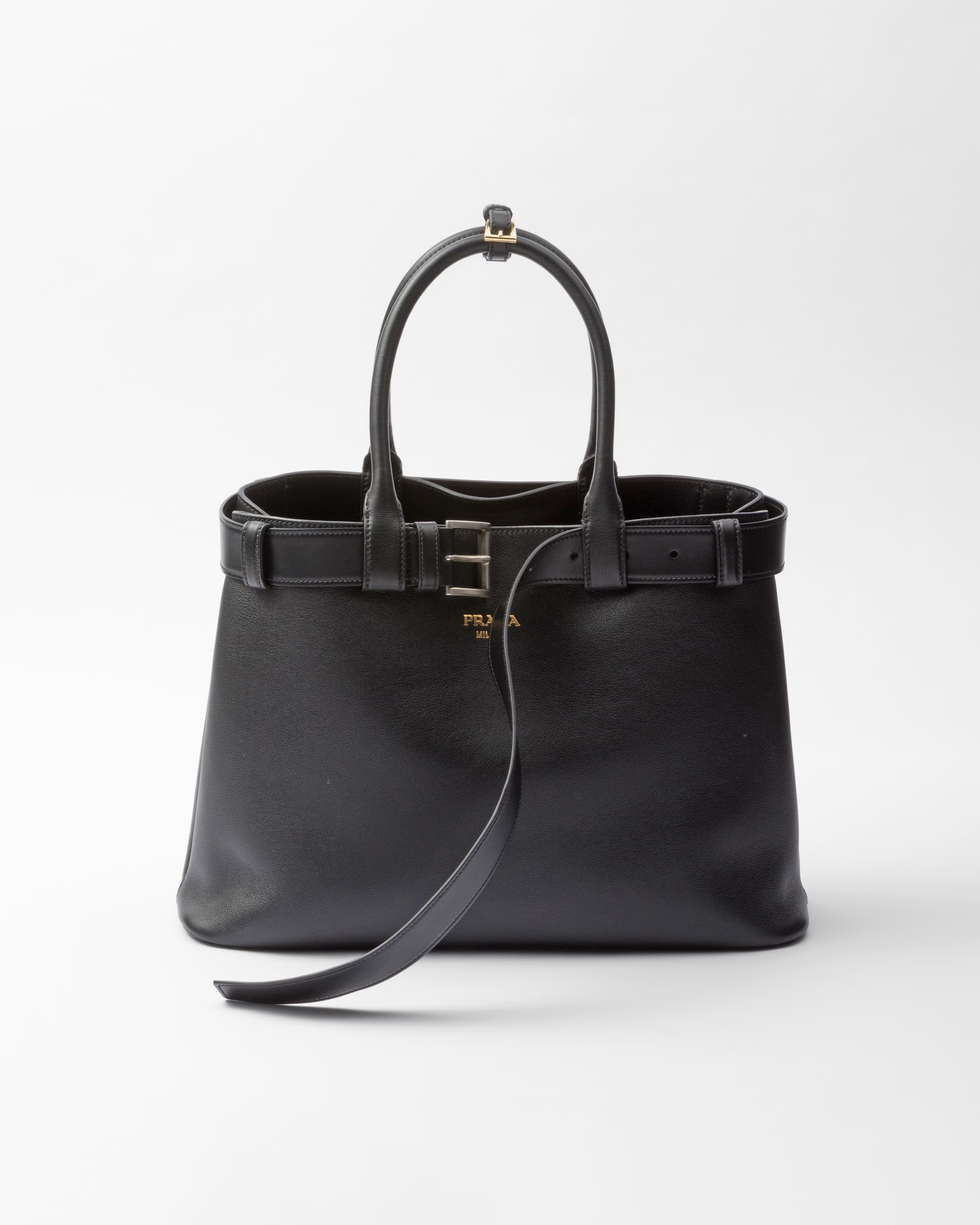 Prada belted bag in black with gold hardware.