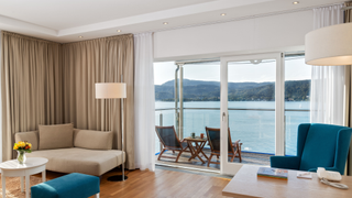 Bedroom with lakeside balcony at Vivamayr.