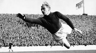 Bert Trautmann of Manchester City in full flight as he leaps across to cover a pile-driver from Rye in their First Division match against Wolverhampton Wanderers. August 1951. (Photo by Abell/Daily Herald/Mirrorpix via Getty Images)