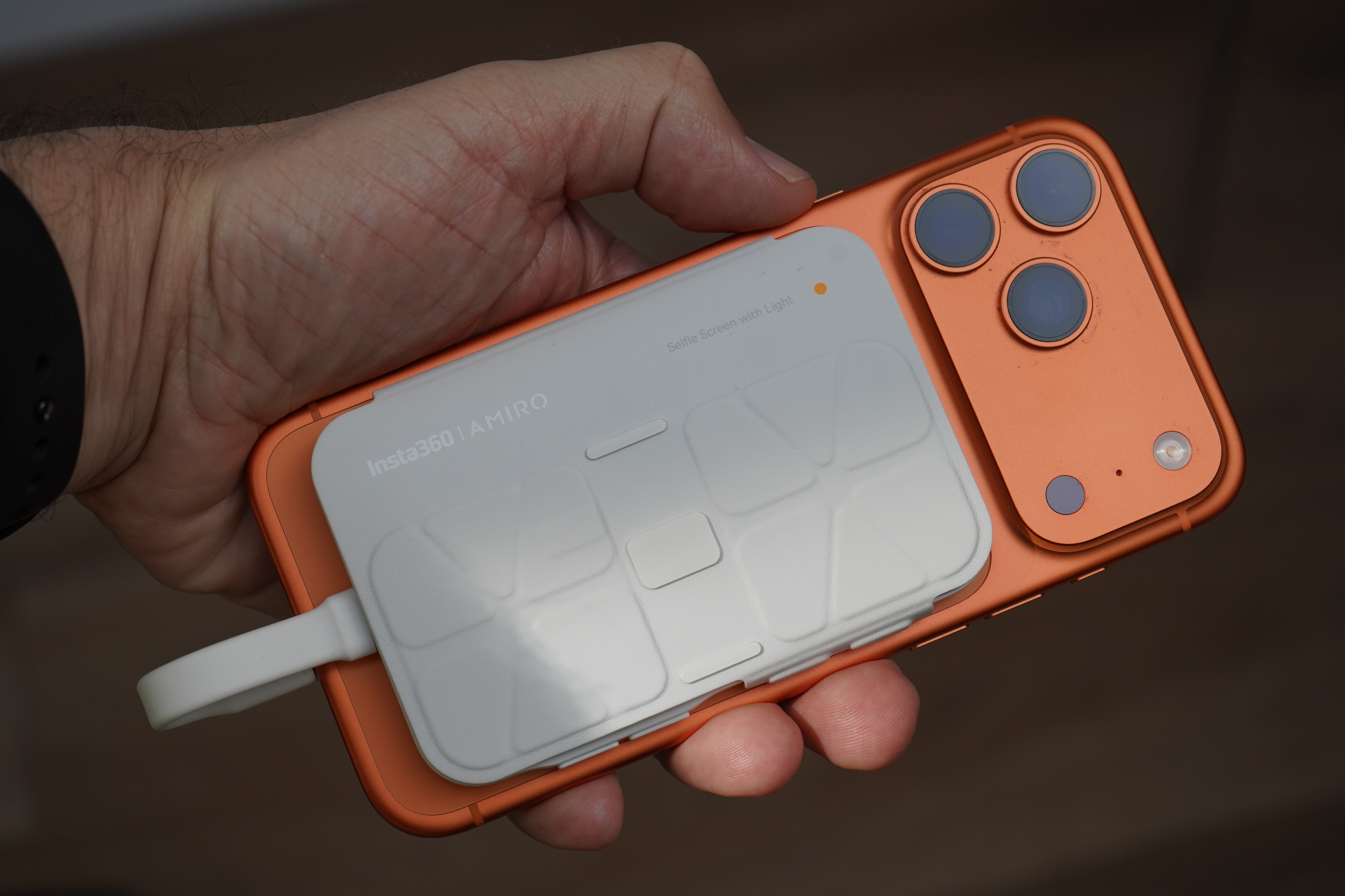 Insta360 Snap in hand with cover over it