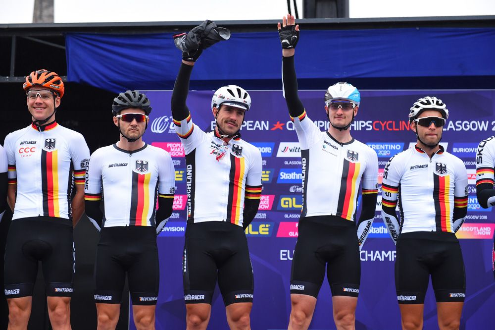 The German team waves at sign on