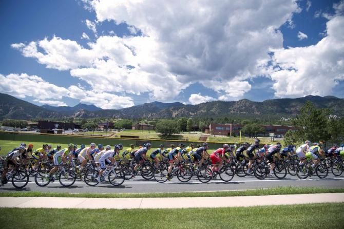 The peloton passes under Colorado's blue skies