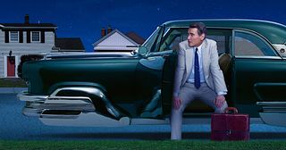 Billy Crudup sitting ina futuristic car in Hello Tomorrow! on Apple TV+.