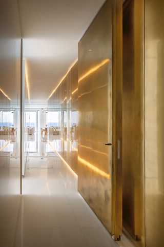 golden corridor at Tel Aviv apartment by Alex Meitlis