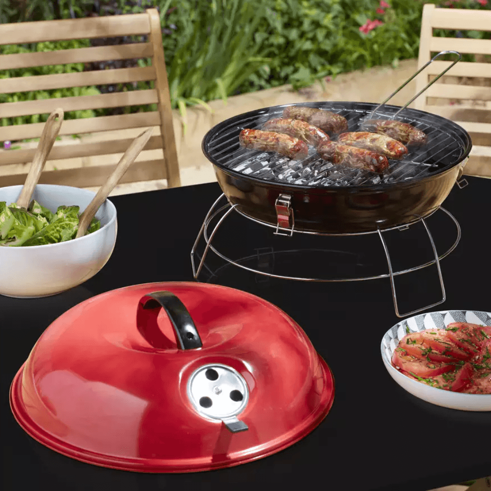 Argos Home BBQ with sausages cooking on the grill
