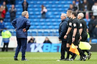 Cardiff manager Neil Warnock, left, had a staredown with referee Craig Pawson and his assistants
