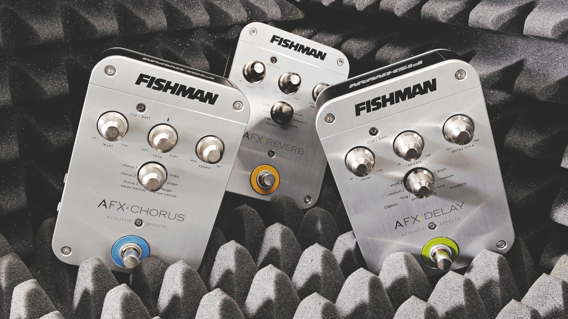 A trio of acoustic guitar pedals in some acoustic foam