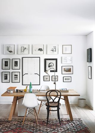 White home office with gallery wall