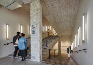 Fotografiska Shanghai by AIM Architecture showing the building's blend of old and new with raw concrete and plush interiors