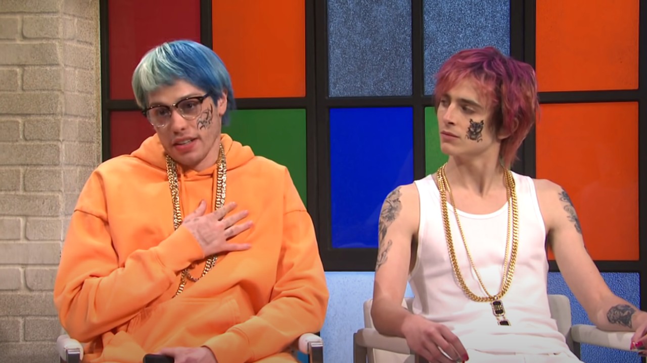 Pete Davidson, left, in an orange hoodie and Timothee Chalamet, right, during an SNL skit.