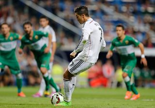 Cristiano Ronaldo scores a penalty for Real Madrid against Elche in September 2014.