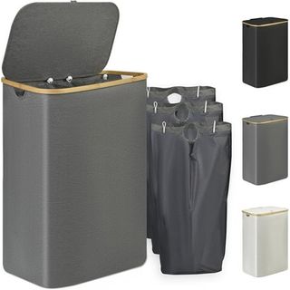 A gray laundry hampers with three divided bags beside it. Hinge lid with a bamboo trim