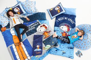 The Lands' End x Peanuts collaboration includes children's clothes and bedroom accessories featuring Astronaut Snoopy.