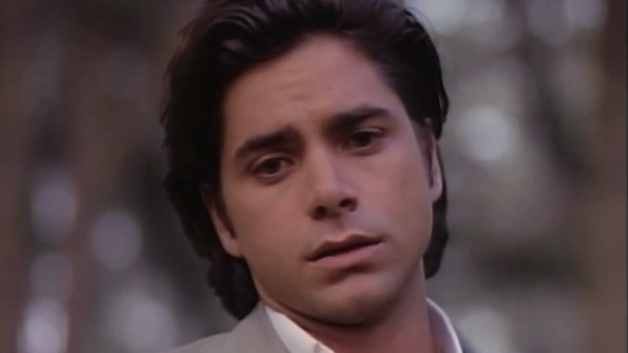 John Stamos in grey suit in Tales From the Crypt "Till Death Do We Part"