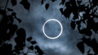 The moon totally covers the sun in a rare "ring of fire" solar eclipse as seen from the south Indian city of Dindigul in Tamil Nadu state on December 26, 2019