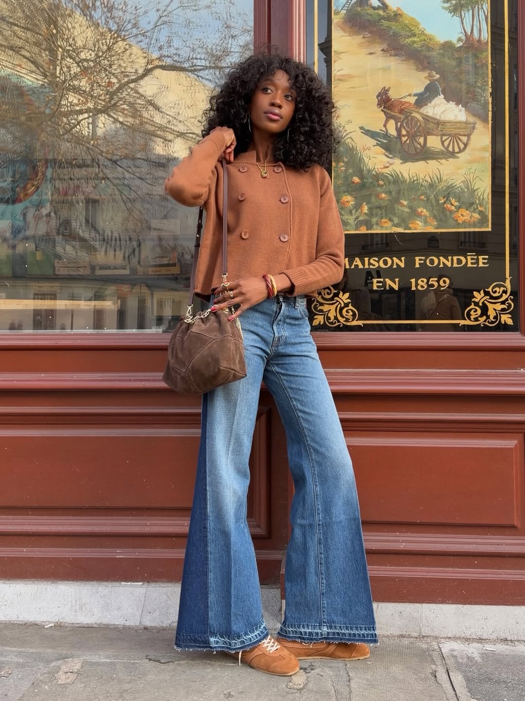 Emmanuelle wearing suede trainers