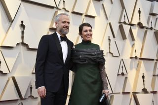 Olivia and her husband, Ed Sinclair, at the Oscars in 2019.