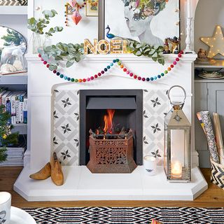White dining room fireplace with patterned geo inset tiles