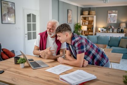 Grandfather and grandson are discussing education