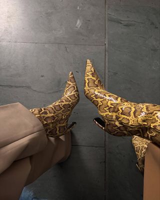 Influencer wearing snakeskin shoes.