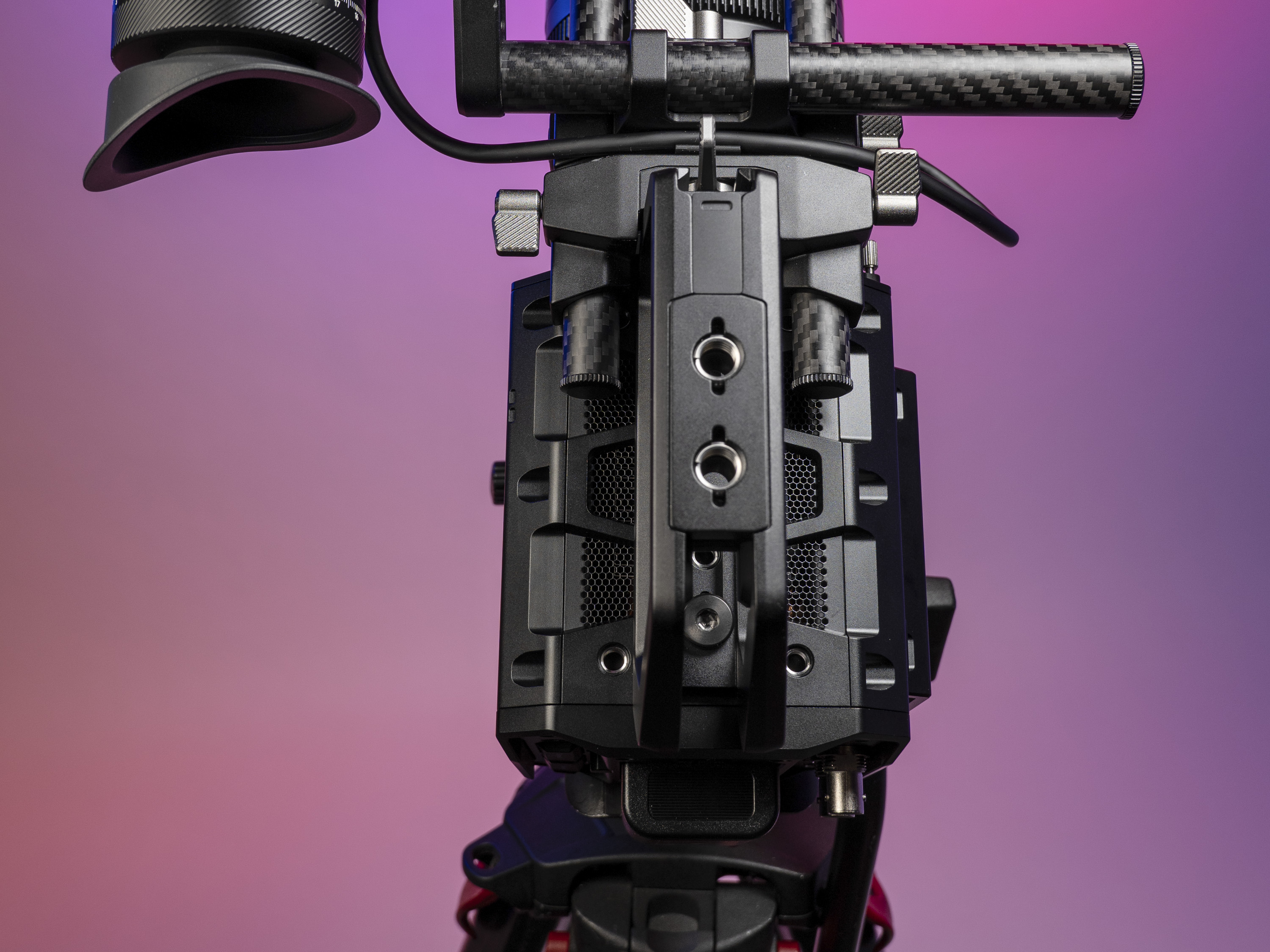 Top view of the Blackmagic Pyxis 6K camera, in the studio with a vibrant magenta background