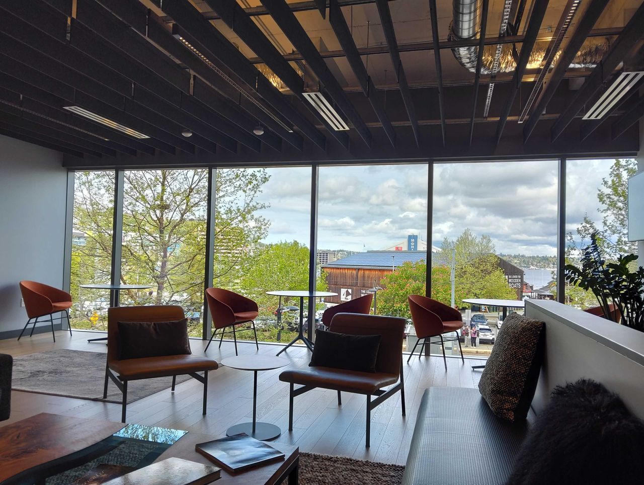 The inside of a building with chairs and large windows