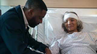 Ashley Thomas and Chipo Chung as Byron and Eleanor in a hospital room in Black Cake