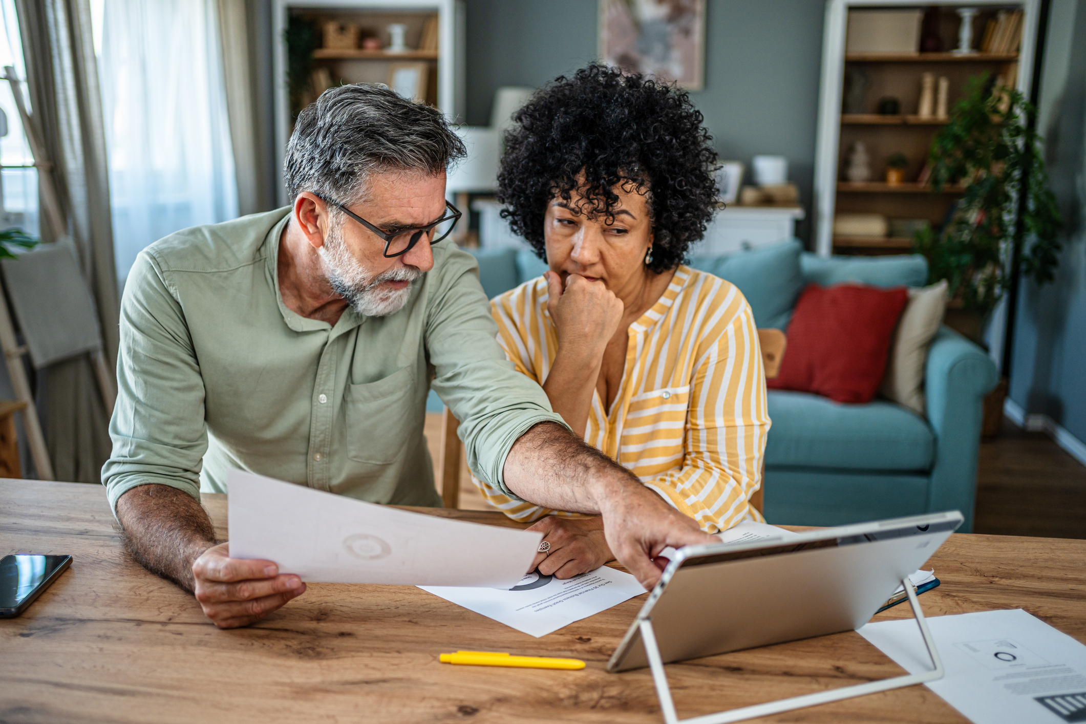 Older couple looking over financial documents