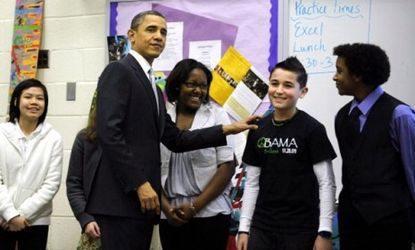 Obama visits with middle schoolers in Virginia before giving a speech vowing to reform the No Child Left Behind Act before the next school year.