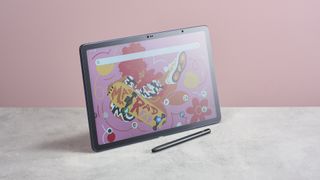 XPPen Magic Drawing Pad on home screen, balanced on its edge with stylus placed in front of it