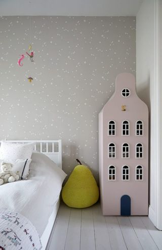 dollhouse shaped toy storage in the bedroom