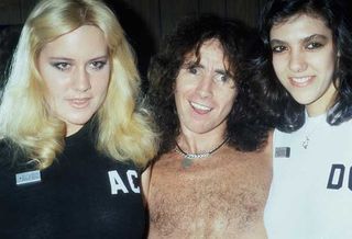 Bon Scott with two girls