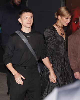 Zendaya and Tom Holland leave the York Theatre where Zendaya wears a black corseted gown and a layered choker