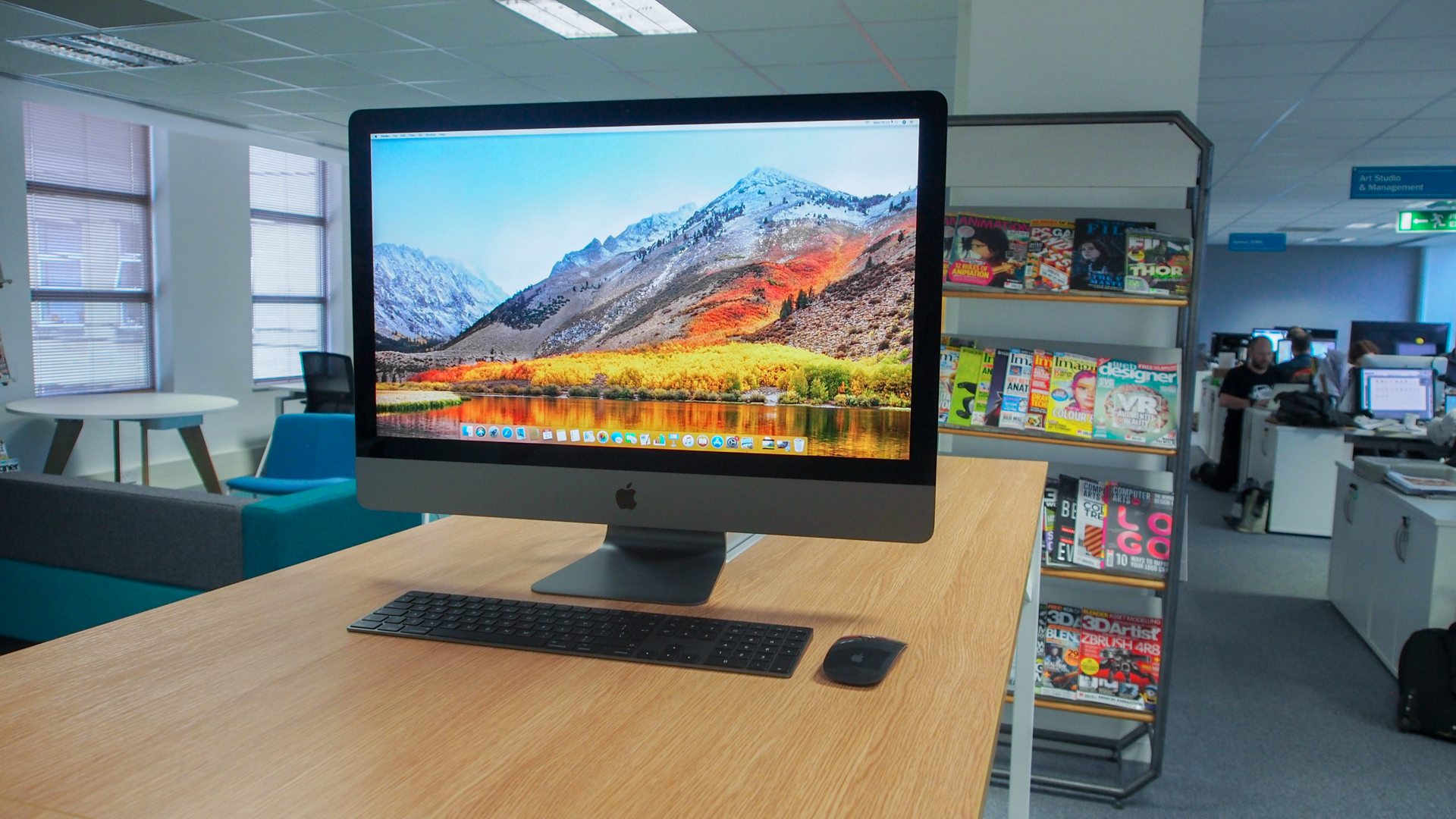 iMac Pro on a table with a keyboard and mouse in an office