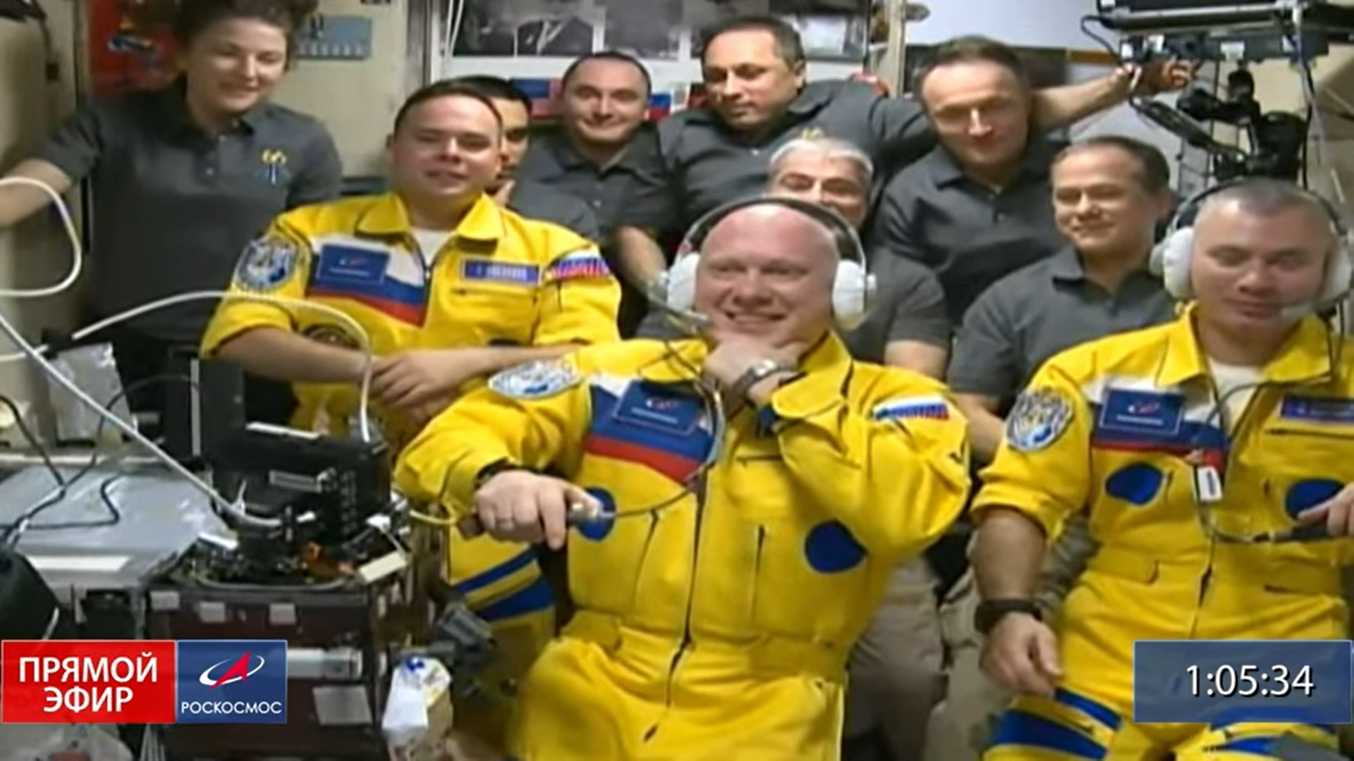 Cosmonauts Oleg Artemyev, Denis Matveev and Sergey Korsakov float aboard the International Space Station after arriving on a Soyuz spacecraft on March 18, 2022. The trio donned bright yellow and blue flight suits as they joined seven other crewmates on the station.