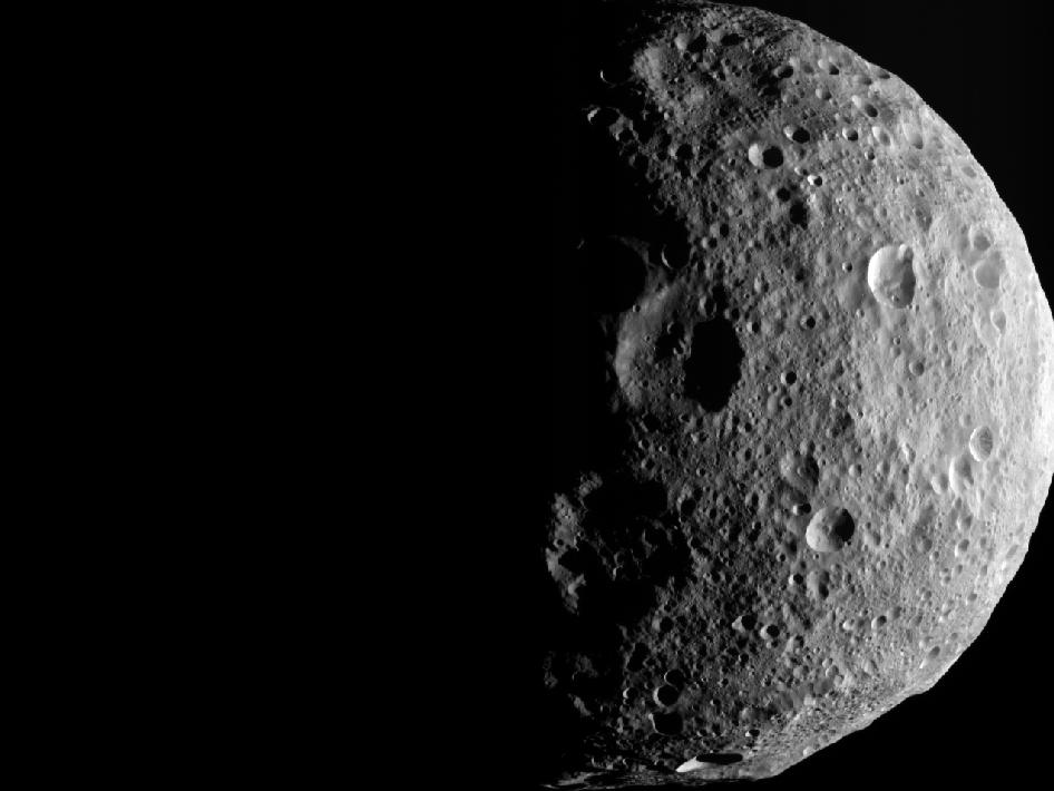 The shadowy outlines of the terrain in Vesta's northern region are visible in this image from NASA's Dawn spacecraft. The image comes from the last sequence of images Dawn obtained of the giant asteroid Vesta as it departed the giant asteroid Sept. 5, 2012.