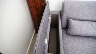 Emma Sofa Bed armrest showing storage inside