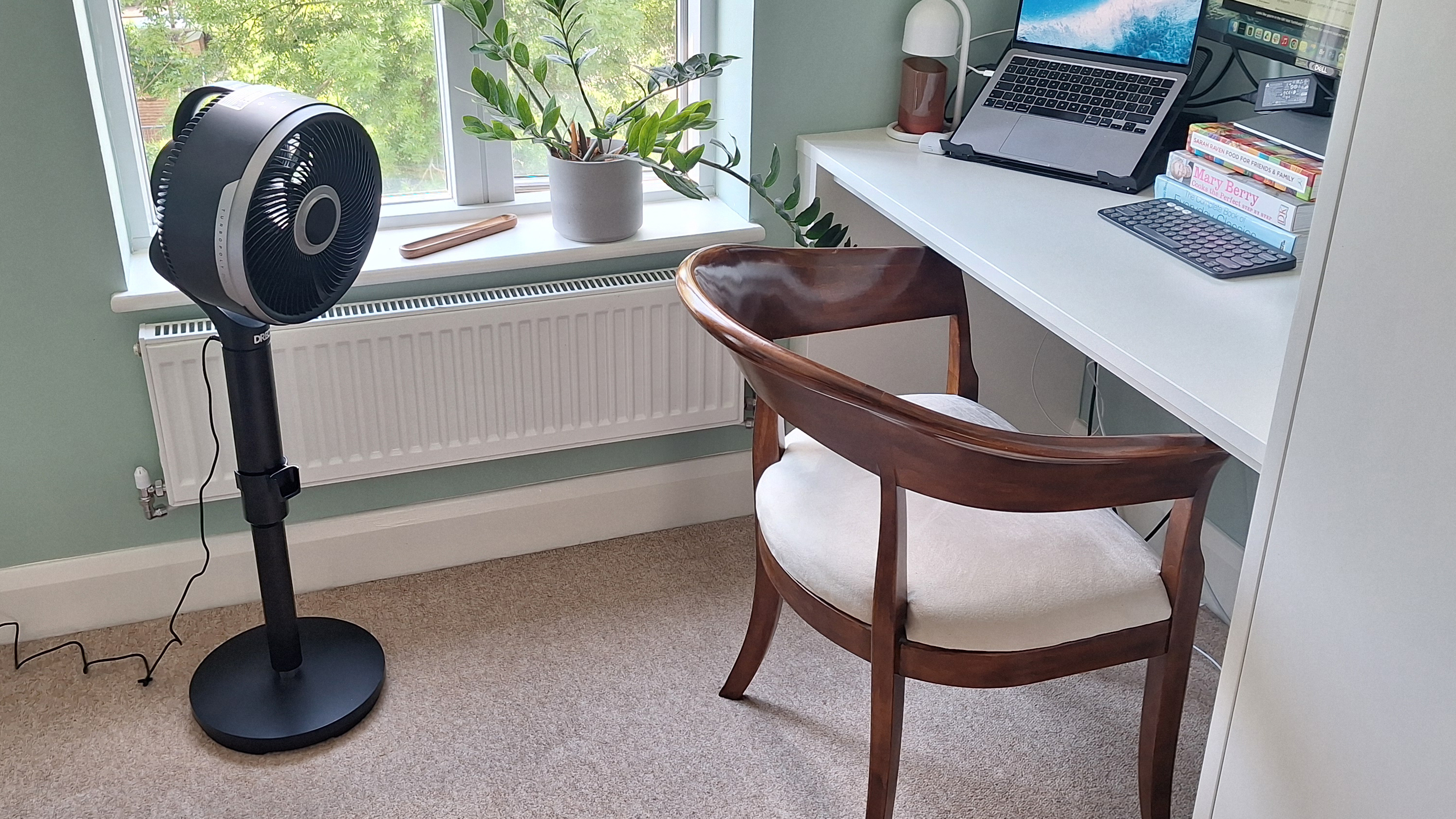 Dreo fan pointing at a home office setup
