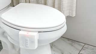 A promotional image of Throne, a digital system used to monitor bowel motions