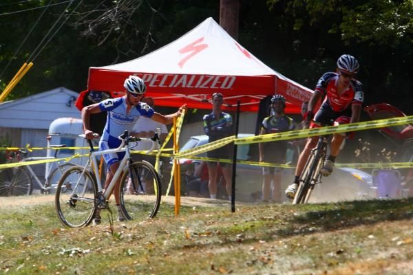 A rider finds his way back on to the course after dropping his chain.